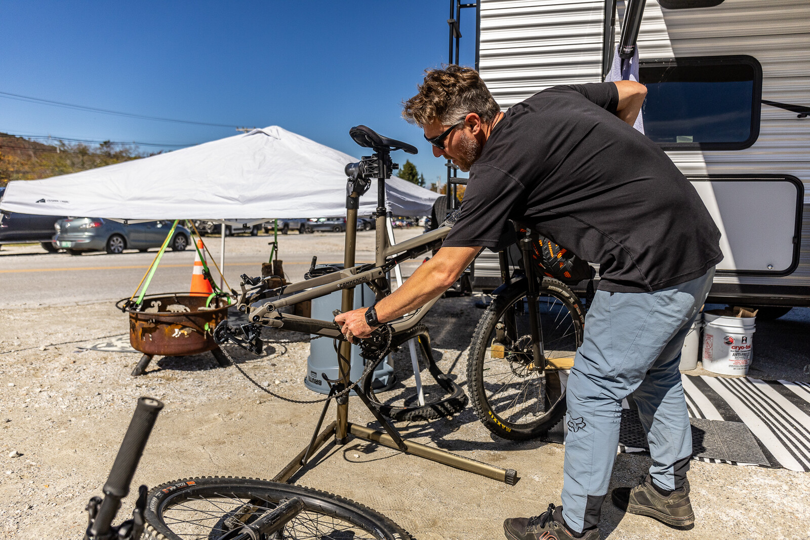 Scott and the family%2C Scott working on his favorite bike his Commencal.jpg?VersionId=XilfiTmidG